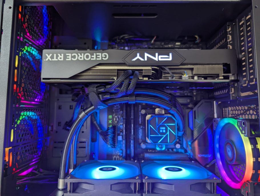 Sample build with Nvidia and liquid cooler Close-up of a gaming PC interior featuring colorful fans and a GeForce RTX graphics card.