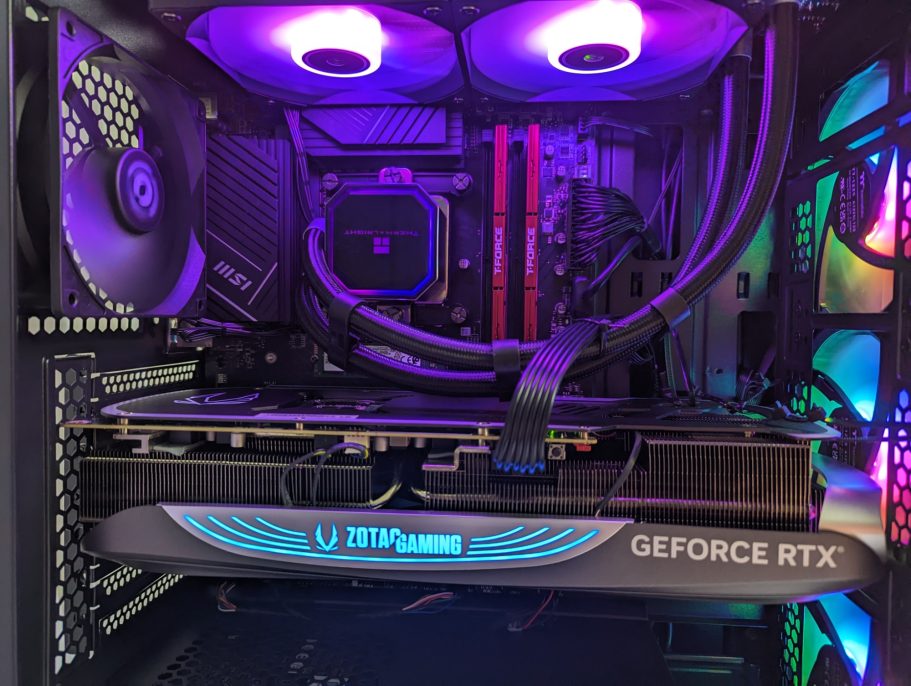 Purple color scheme inside PC Close-up of a gaming PC interior with a GeForce RTX graphics card and colorful LED lighting.